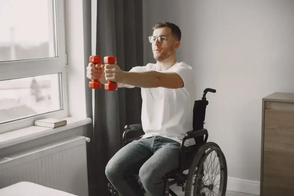 Image of man doing exercise in his wheelchair to aid weight loss Billingshurst