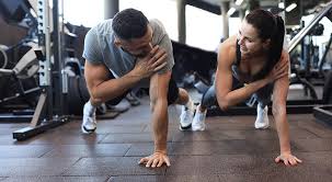 Image of man and woman doing Cardio Billingshurst to tone their arms. 